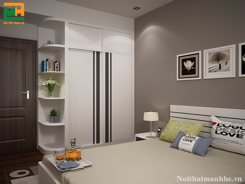 Phòng ngủ có tủ quần áo cánh trượt được sơn trắng, phía giữa được viên đen tinh tế