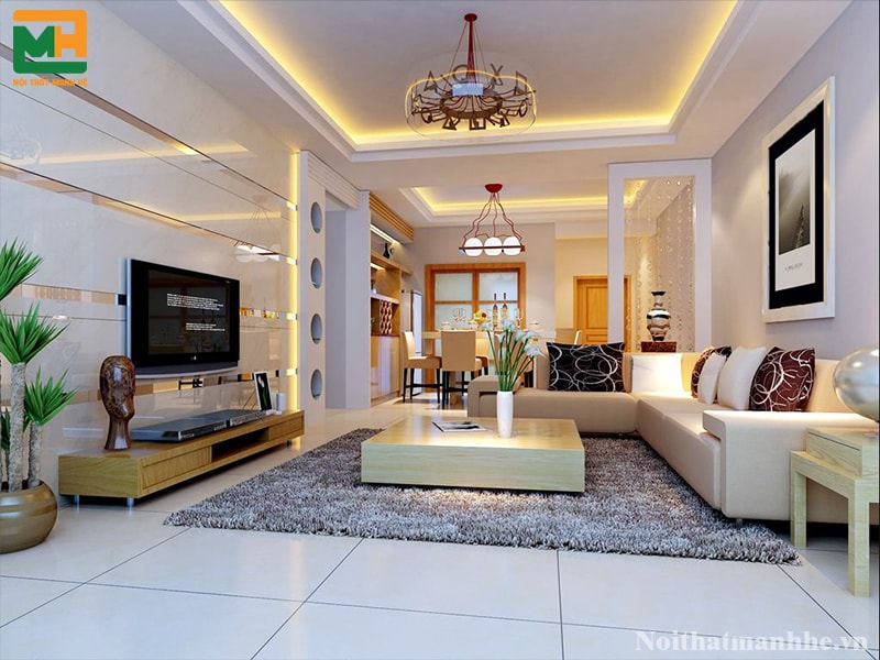 Thảm trải lông ngắn màu xám nâu đượt đặt dưới mép ghế đến chiếc bàn mang đến vẻ đẹp hiện đại cho phòng khách