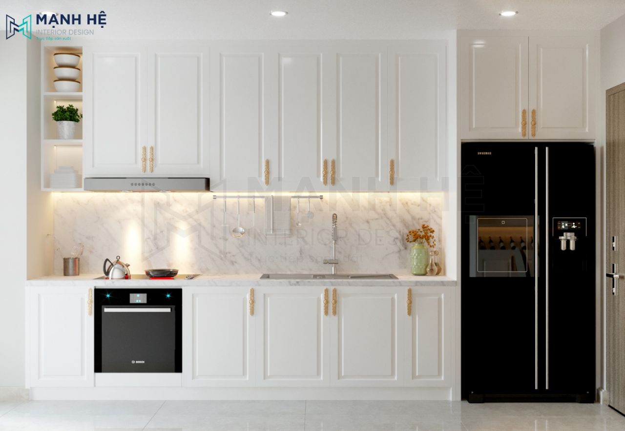 Tủ bếp tone trắng kết hợp với đèn âm tường làm tăng thêm tính thẩm mỹ và giá trị phòng bếp