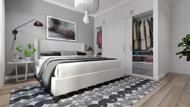 Tủ quần áo 2 cánh lớn được sơn trắng, thiết kế cao đụng trần, bên trên có các ngăn nhỏ để đựng đồ đạc, bên trong tủ có các bậc đựng túi xách, phụ kiện thời trang