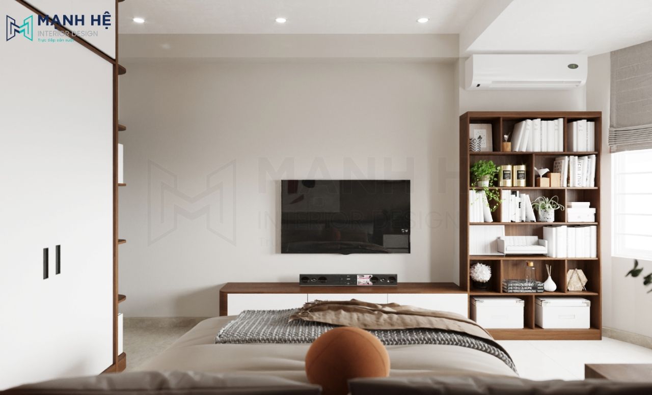 Kệ tivi treo tường tối ưu diện tích và kệ sách lớn giúp tăng không gian lưu trữ và tận dụng trang trí theo sở thích cá nhân, được thiết kế với tone gỗ trầm cùng tone với phòng ngủ tạo sự liên kết