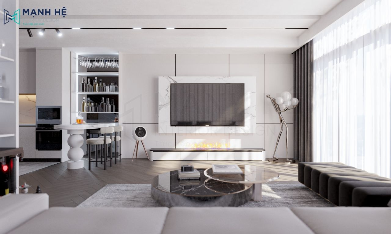 Sử dụng bàn trà đôi hình tròn mặt đá, vách tường sau tivi được ốp đá marble vân mây