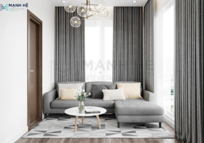 Thiết kế khu vực thư giãn với ghế sofa chữ L màu xám sang trọng trong phòng ngủ master