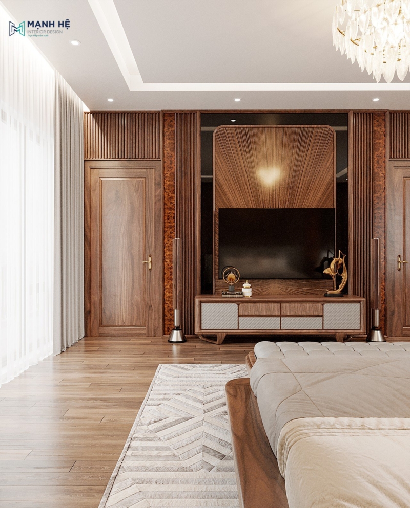 Kệ tivi với vách trang trí lam gỗ phía sau được thiết kế cách điệu kết hợp hộc tủ tay nắm âm