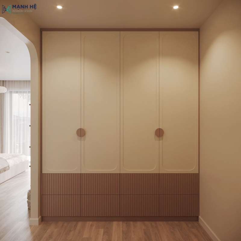 Thiết kế hệ tủ quần áo kịch trần với gam màu trắng, hồng kết hợp tay nắm hình tròn hài hòa với tổng thể thiết kế căn phòng bé