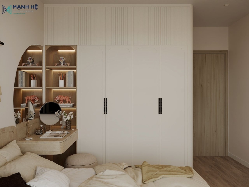 Hệ tủ quần áo cao kịch trần với gam màu trắng chủ đạo kết hợp bàn trang điểm nhỏ gọn giúp tối ưu công năng cho phòng ngủ nhỏ