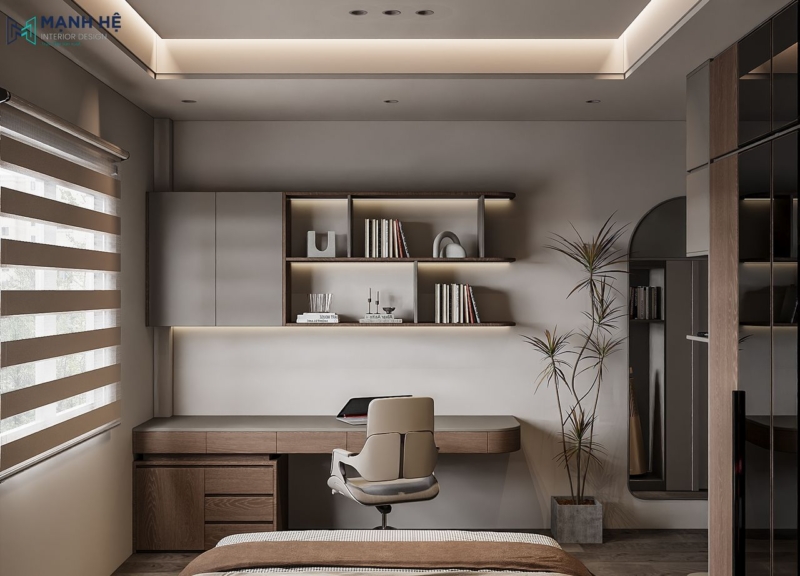 Bàn làm việc được đặt cạnh cửa sổ giúp đón nhiều ánh sáng tự nhiên cho không gian