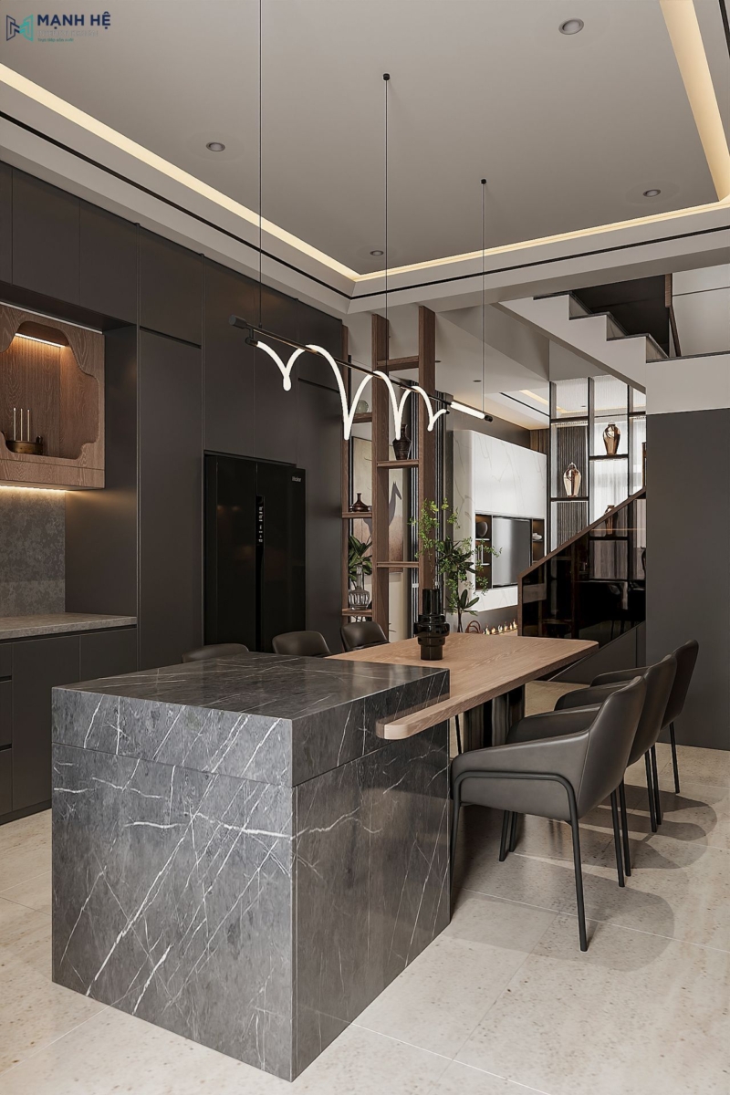 Đảo bếp được tích hợp với bàn ăn 6 chỗ ngồi với gam màu đen - gỗ tạo độ tương phản cao cho không gian