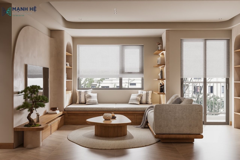 Tường bo cong xi măng mịn và hệ tủ TV gỗ kết hợp cây bonsai trong phòng khách phong cách Japandi phối Zen.