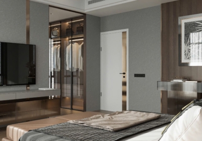 Kệ tivi treo tường kết hợp vách ngăn, sử dụng chất liệu ánh kim sang trọng, mở lối về không gian phòng thay đồ được giấu kín phía sau