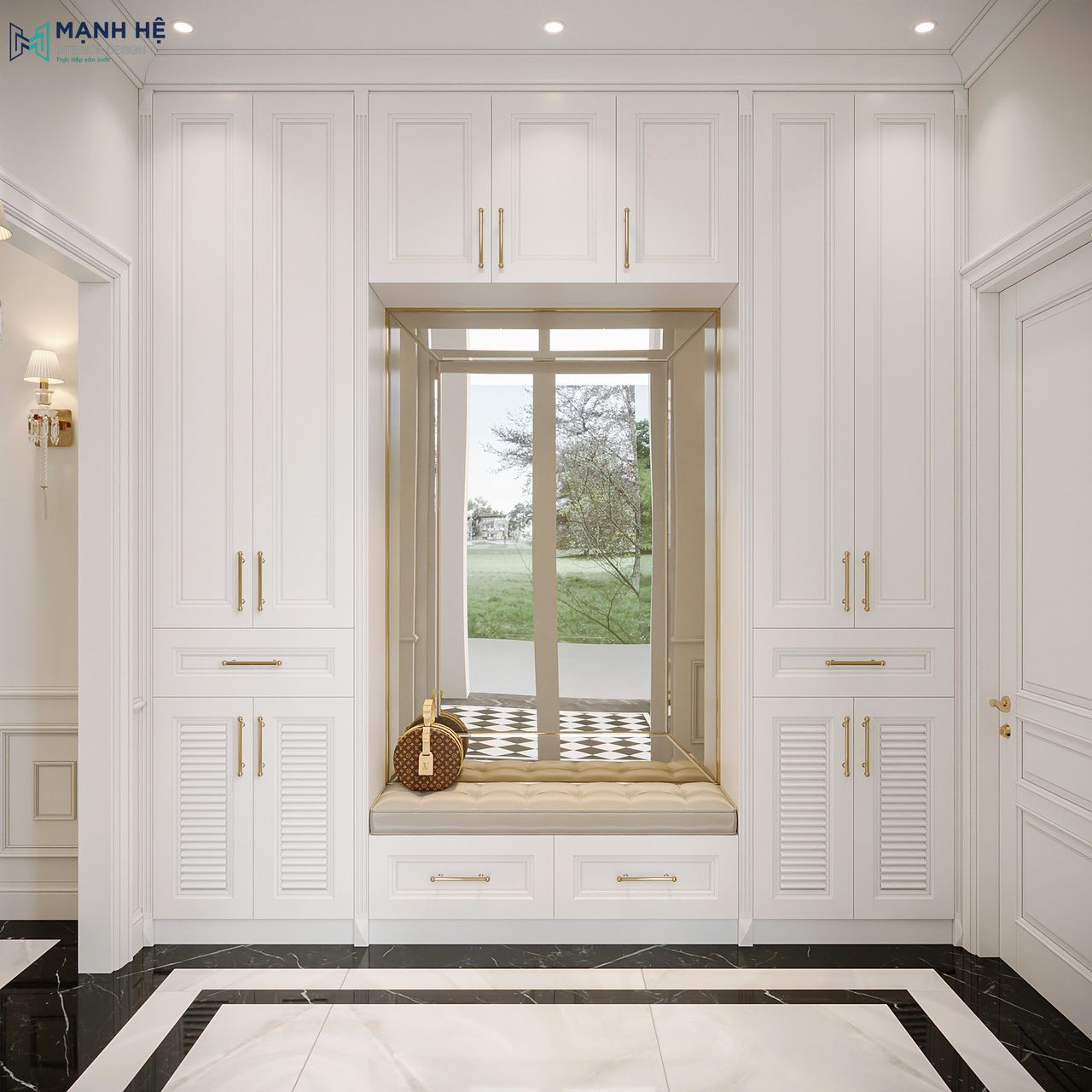 Hệ tủ giày âm tường đặt ngay lối vào chính biệt thự, thiết kế đối xứng hai bên với cánh tủ pano, tay nắm mạ vàng, ở giữa là ghế ngồi bọc nệm màu kem kết hợp gương có hộc kéo bên dưới