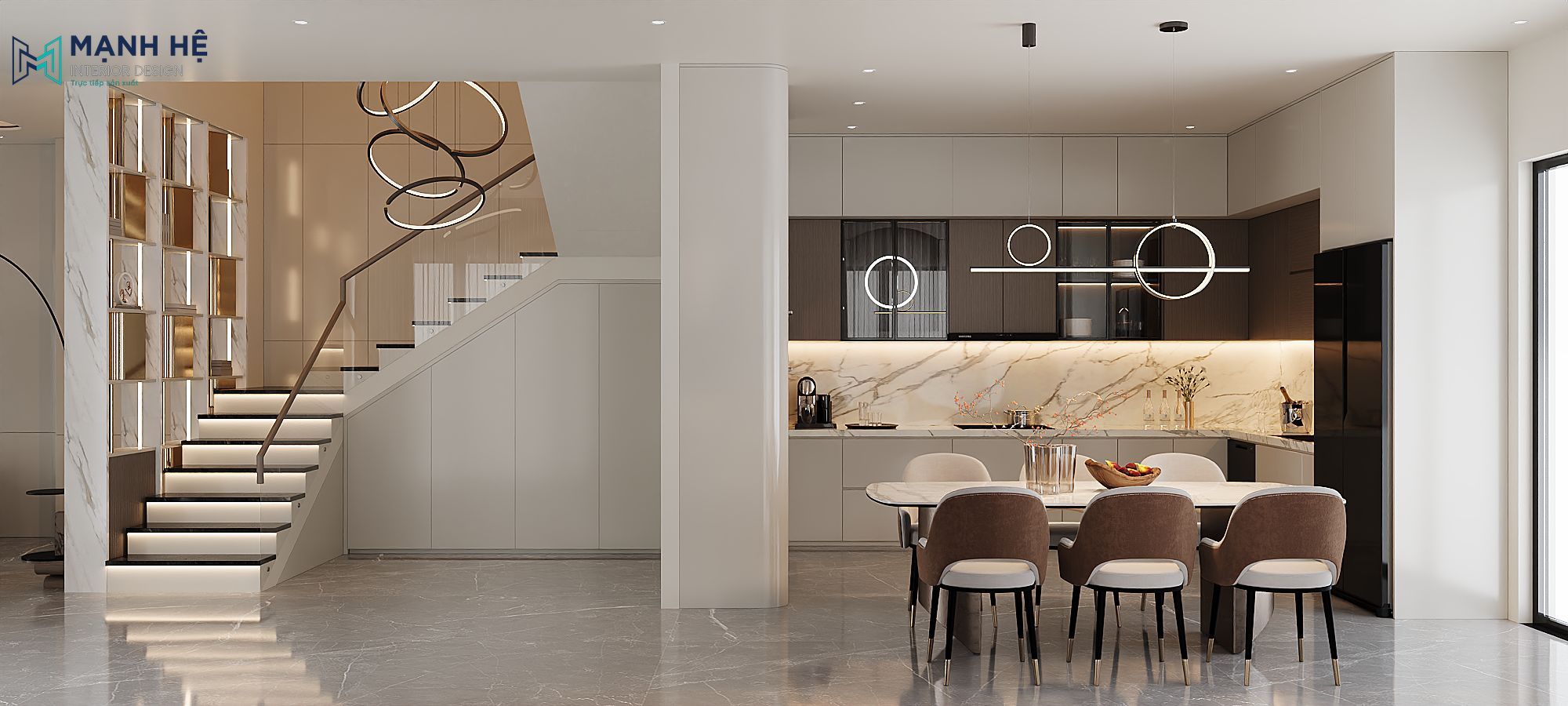 Toàn cảnh phòng bếp và bàn ăn hiện đại với bàn đá, đèn thả tròn và hệ tủ bếp chữ L màu be – nâu sang trọng