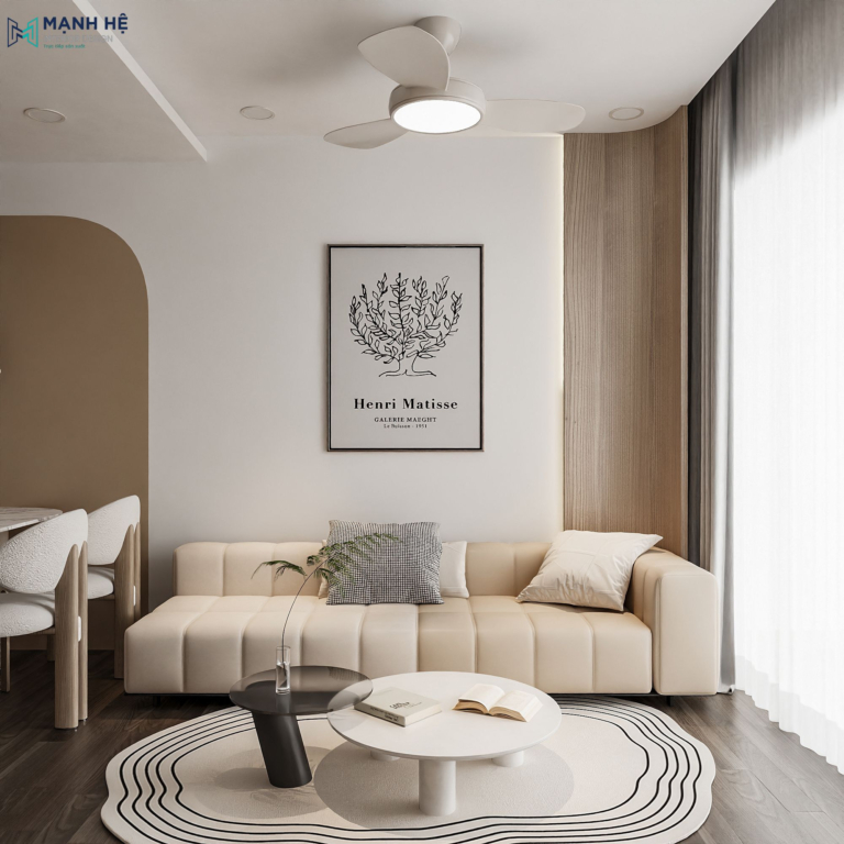 Không gian phòng khách căn hộ 45m² cho thuê cao cấp với sofa bệt da màu kem, bàn trà đôi tròn và vách tường gỗ trang trí.