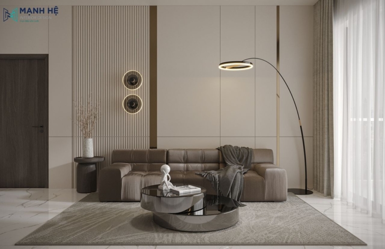 Không gian phòng khách chung cư sử dụng gam màu xám chủ đạo làm nền cho chiếc ghế sofa nâu ấm cúng kết hợp bàn trà đôi màu đen