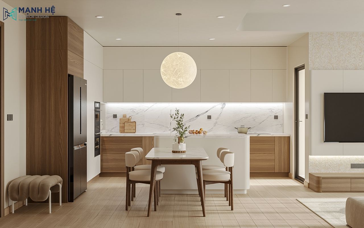 Hệ tủ bếp chữ L phối hợp tinh tế giữa gam trắng và nâu gỗ, điểm nhấn đảo bếp liền bàn ăn tiện nghi