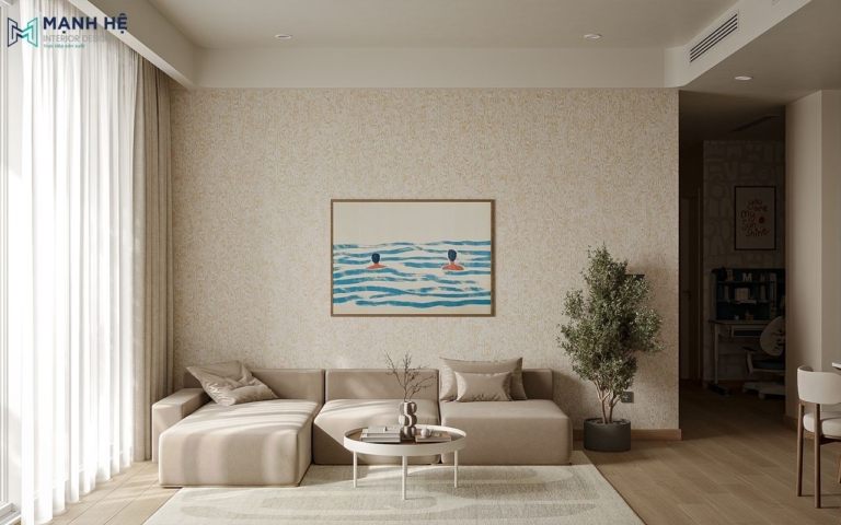 Không gian phòng khách chung cư phong cách Japandi với sofa be dáng thấp kết hợp bàn trà tròn tối giản, điểm nhấn tranh treo tường thư giãn