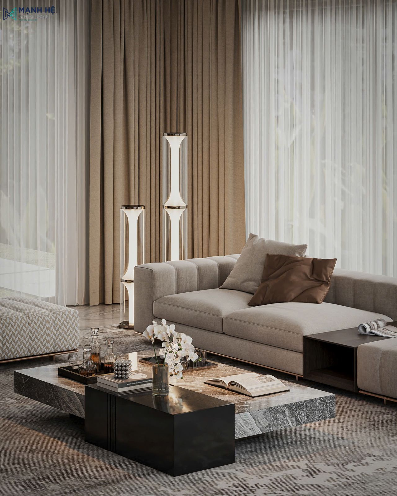 Bàn trà đá vân mây kết hợp khối đá đen bóng, cùng sofa be bọc vải êm ái