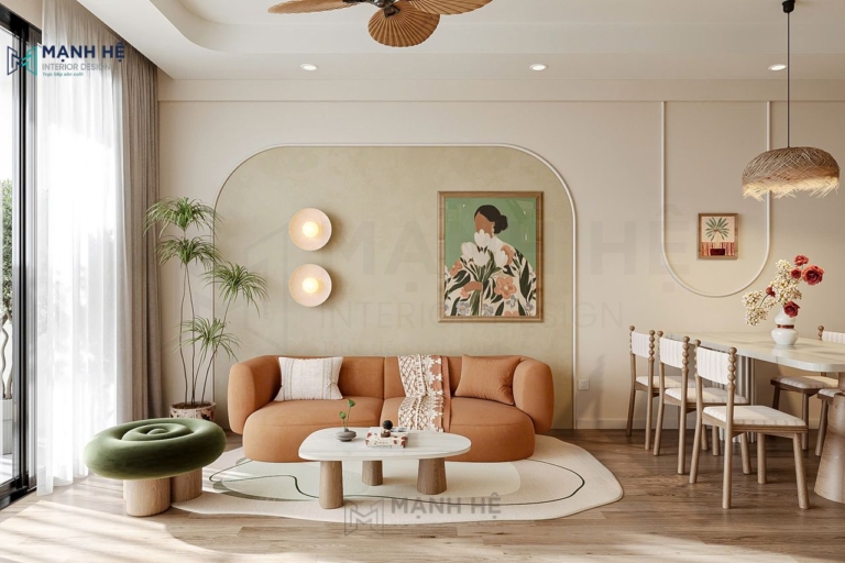ghế sofa màu cam đất kết hợp bàn trà gỗ mặt trắng và cây xanh trang trí